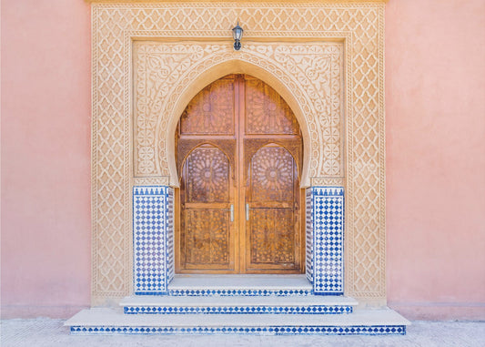Brown door, blue tiles, pink wall in Morocco | Canvas